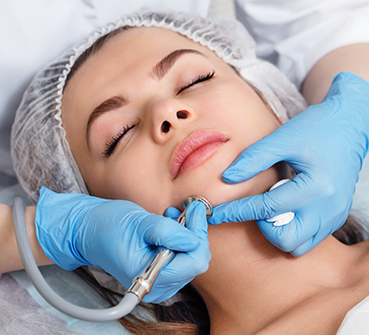 young lady getting laser skin care treatment