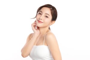 A woman showing the results of laser skin treatments in South Miami.